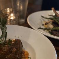 Slow Braised Beef Short Ribs · Slow cooked with fresh herbs and chiles, served over chipotle mashed sweet potatoes, grilled...