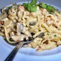 Diablo Crawfish Pasta · Fresh crawfish tail meat sauteed with onions, mushrooms, and basil over linguini in a spicy ...