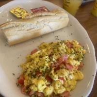 Perico · Fresh scrambled eggs with chopped tomato, onions and parsley.