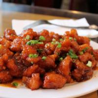 Spicy 5 Flavor Chicken · Garlicky and savory breaded chicken topped with green onions