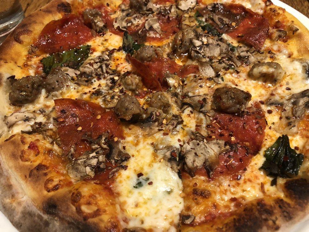 Pepperoni Pizza · Rustic and spicy pepperoni with fresh Mozzarella and wild Greek oregano.