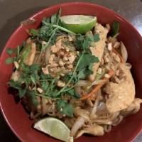 Pad Thai · Rice Noodles stir-fried in our Spicy Pad Thai sauce with eggs, carrots, crushed peanuts on t...