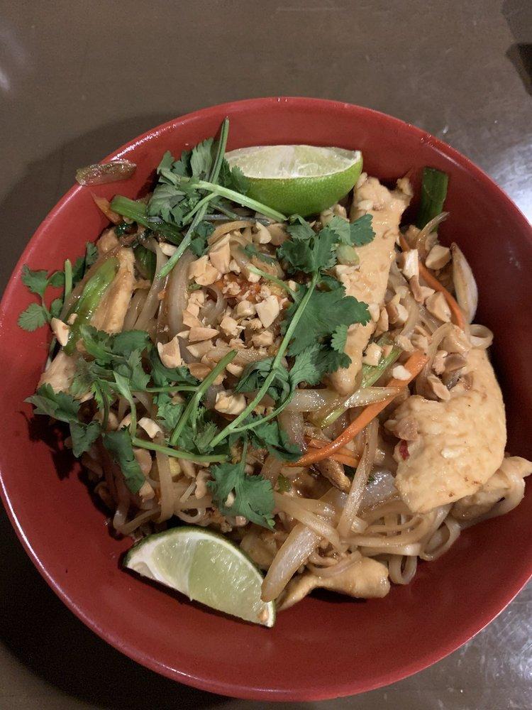 Pad Thai · Rice Noodles stir-fried in our Spicy Pad Thai sauce with eggs, carrots, crushed peanuts on top, yellow and green onions. Served with cilantro and a lime wedge on the side.
