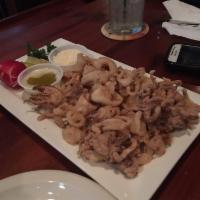 Fried Calamari · Served with melted garlic butter and parmesan cheese.