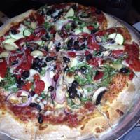 Veggie Pizza · Arugula, portabella mushrooms, roasted garlic, zucchini, red onions, black olives, and roast...