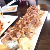 Tipsy Roll · Shrimp tempura, crabmeat, avocado inside and seared albacore and crispy onion on top with sp...
