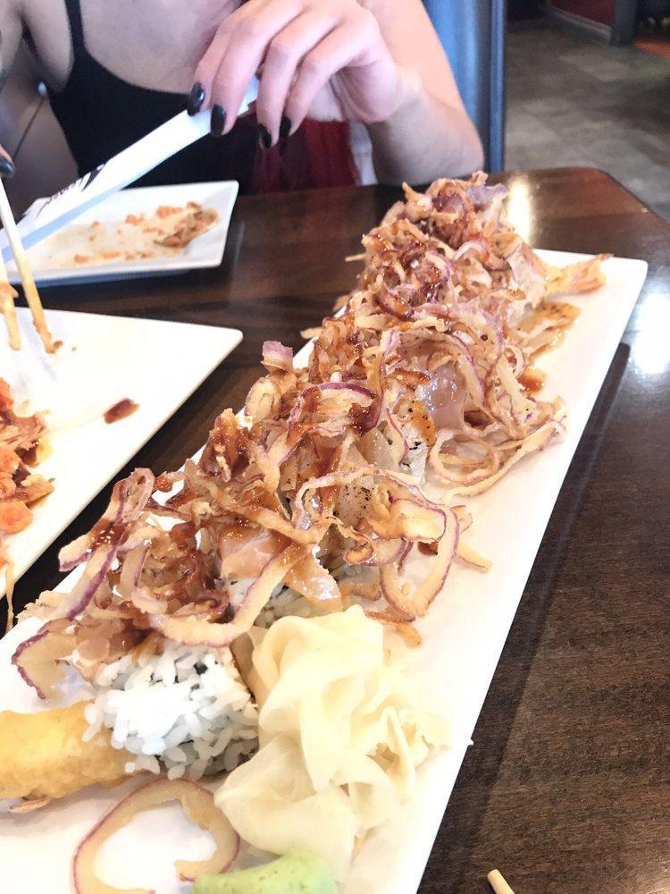 Tipsy Roll · Shrimp tempura, crabmeat, avocado inside and seared albacore and crispy onion on top with special sauce.