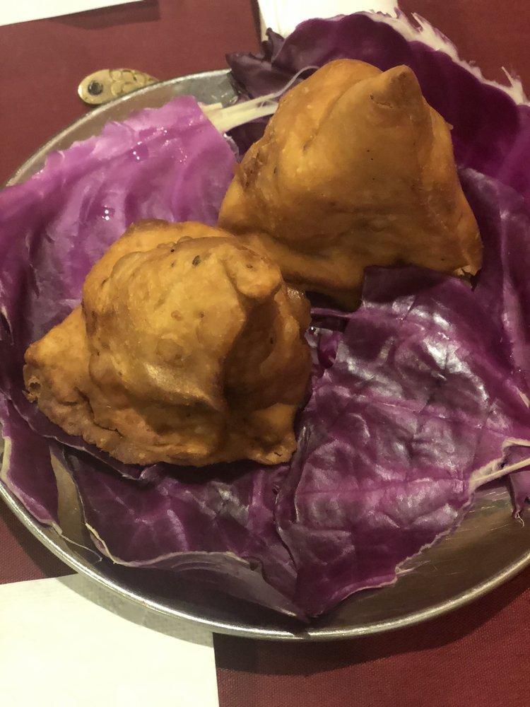 Vegetable Samosas · 2 crisp patties filled with potatoes and peas mildly spiced and deep fried.
