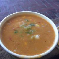 Organic Southwestern Corn Chowder · A delectable blend of roasted corn, red bell peppers, chipotle chilies and potatoes. Garnish...