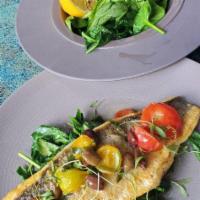 Branzino · Spinach, heirloom tomatoes, taggiasca olives, and white wine butter.