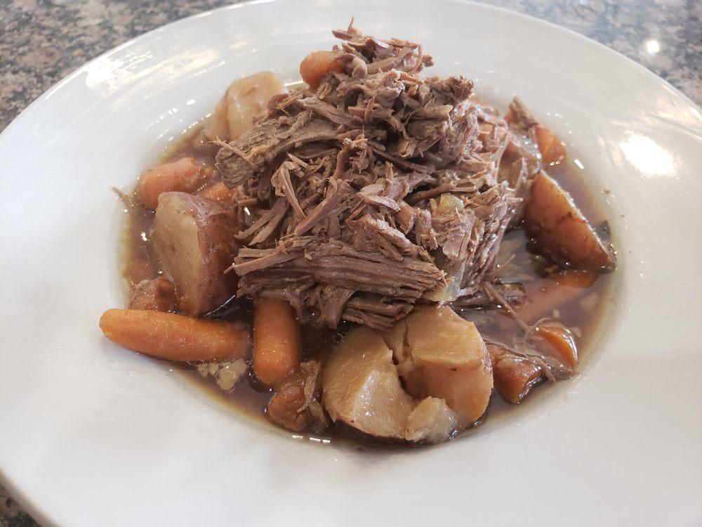 Pot Roast · Slow-cooked tender beef served with potatoes and carrots in a beef broth and choice of bread.