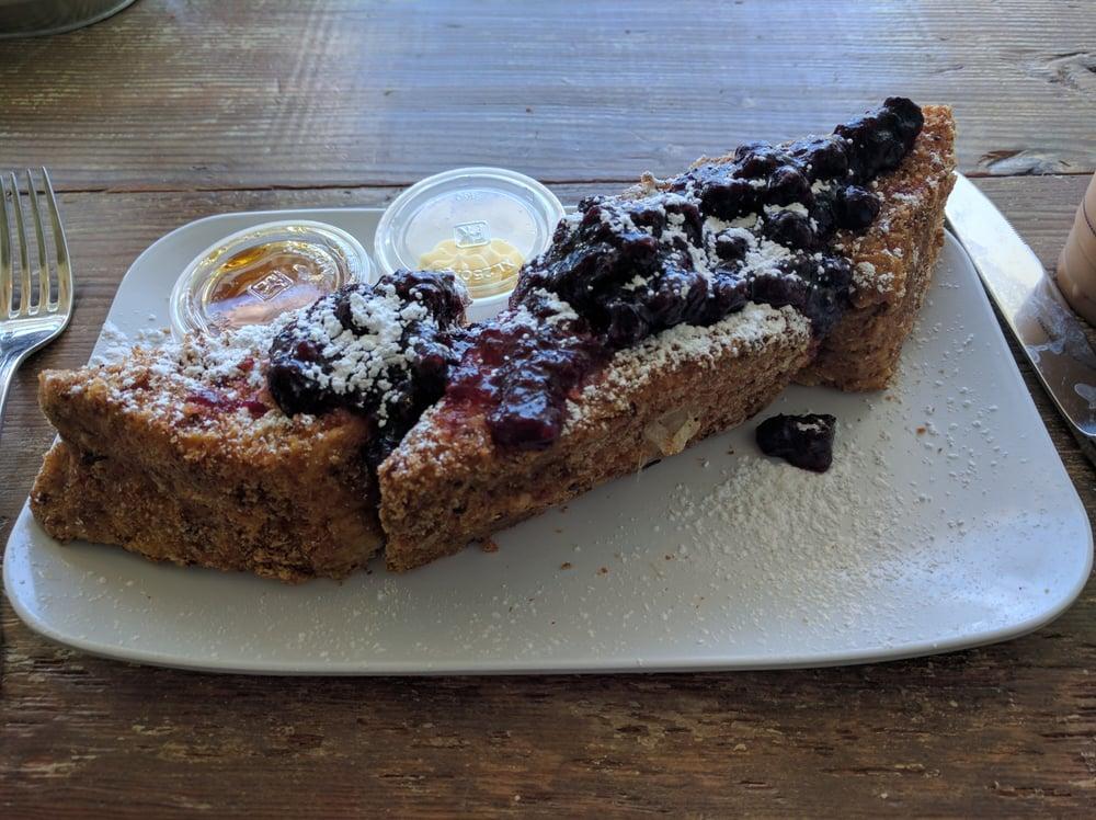Stuffed French Toast · Brioche french toast stuffed with cream cheese, toasted almonds and a seasonal fruit compote with 100% pure maple syrup.