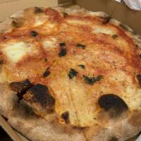 Margherita Pizza · Tomatoes, mozzarella cheese and basil.