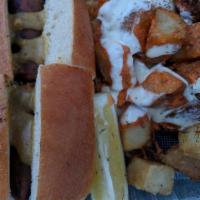 Patatas Bravas · Crispy potatoes, spicy bravas sauce, garlic aioli, and dill.