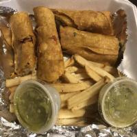 Flautas · Filled with shredded chicken, cheese, topped with salsa verde, sour cream, queso fresco, a s...