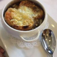 French Onion Soup · Carmelized local onions, beef stock, thyme, Pt. Reyes Toma, Focaccia crisp.