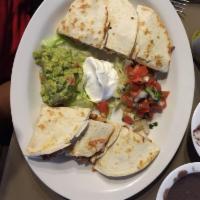 Fajita Quesadilla · Your choice of grilled beef or grilled chicken quesadilla, served with pico de gallo, sour c...