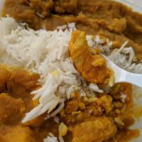 Chicken Curry · Chopped boneless chicken, diced onion and garlic, cooked with turmeric and masala spices in ...