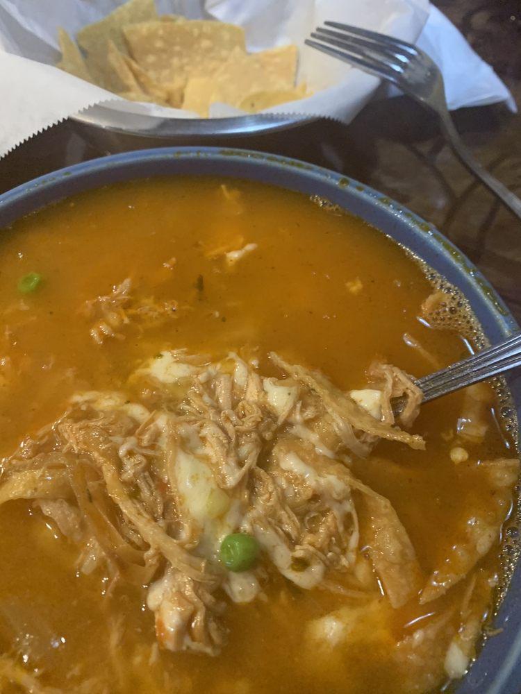 Tortilla Soup · Chicken broth with rice and chicken chunks, pico de gallo, fried tortilla strips, and shredded cheese. 