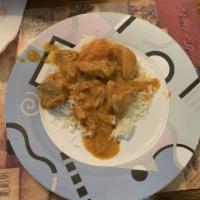 Chicken Madras · Boneless chicken cooked in hot curry sauce with blended fresh tomatoes and coconut milk. Hot...