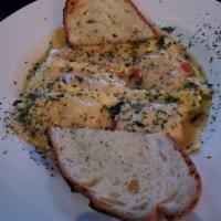 Lobster Ravioli · Topped with a sage and chive white wine sauce.