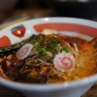 Volcano Ramen · Tonkotsu salt flavor with chashu. Stir fried bean sprouts and onions with pork, 1/2 egg, fis...