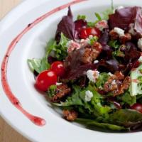 Napa Walnut Salad · Spring mix, tomatoes, aged Gorgonzola, candied walnuts and raspberry vinaigrette.