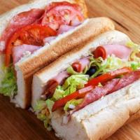 Italian Sub · Ham, salami, mozzarella, onions, green peppers, black olives, lettuce and tomatoes. Served w...