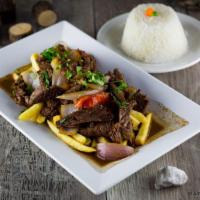 Lomo Saltado Tayta / Beef Strips, Sauteed with Onions and Tomatoes · 
