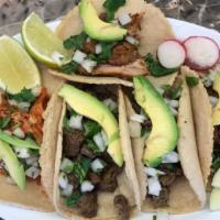 Tacos · Corn tortillas stuffed with your choice of meat. Garnished with chopped onions and cilantro....