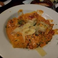 Lobster Ravioli · Lobster, spicy pomodora sauce, crushed red peppers, diced tomato, shaved Parmesan and fresh ...
