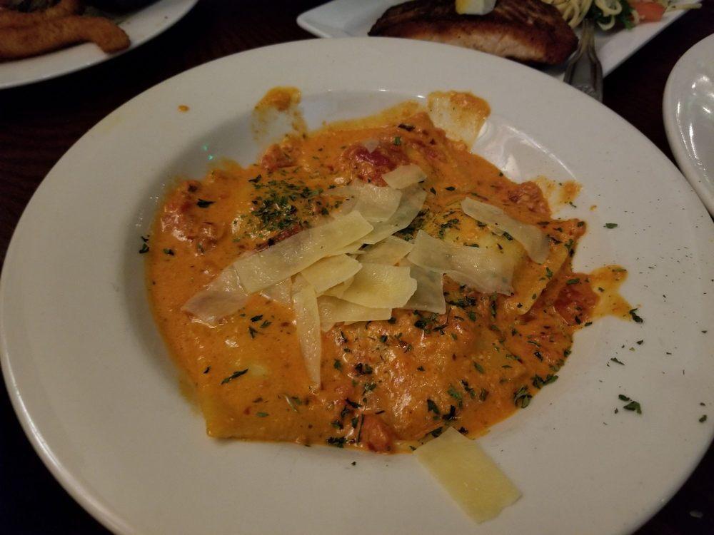Lobster Ravioli · Lobster, spicy pomodora sauce, crushed red peppers, diced tomato, shaved Parmesan and fresh basil.