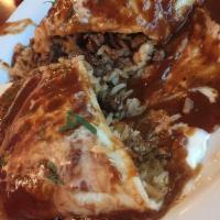Burrito Colorado · A large burrito filled with chopped, grilled steak, rice, beans, onions, and cilantro. Toppe...