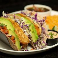 Grilled Fish Tacos · 2 grilled fish tacos on flour tortillas with shredded cabbage, sliced avocado and pico de ga...