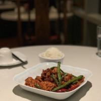 Chong Qing Hot Chicken · Sichuan style spicy sauce over deep-fried chicken thighs.