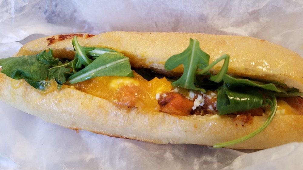Beef Bulgogi Melt Sandwich · Caramelized onion, roasted sweet red peppers, mushroom, provolone, pickled jalapenos, greens, mustard and garlic aioli on French hoagie.