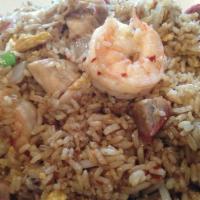 House Special Fried Rice · Shrimp, roasted pork, ham, chicken, egg, onions, green onions and bean sprouts stir-cooked w...