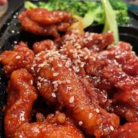 Sesame Chicken · Sweet crispy white meat chicken with broccoli and sesame seeds.