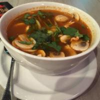 Tom Yum Soup · Clear chicken soup with lime juice, lemongrass and kaffir lime leaf flavor, Thai chili, toma...