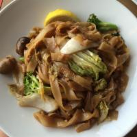 Brown Noodle · Flat rice noodle sauteed with soy sauce, egg, seasonal Asian green broccoli, mushroom and ba...
