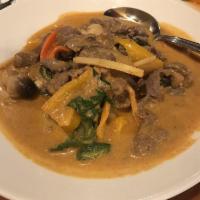 Red Curry · Your choice of meat sauteed with mushrooms, bamboo shoots, chili peppers and basil in red cu...