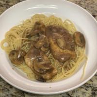 Chicken Marsala · Chicken scallopini with mushrooms sauteed in a marsala wine sauce. Served with spaghetti and...