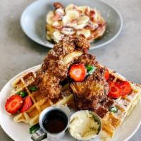 Chicken and Waffles · Light and fluffy waffles topped with crispy fried chicken and lathered with a maple honey ja...