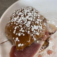 Monte Cristo Sliders · 3 brioche slider buns lightly egg battered and layered up with ham, turkey, and melted chees...