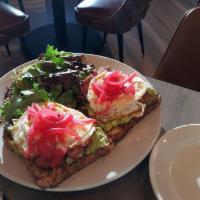 Avocado Toast · Smashed avocado, fried egg, pickled onion, served on a country white bread, garden fresh salad