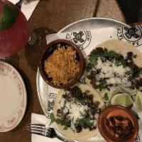 Carne Asada · citrus marinated grilled steak, queso Cotija, árbol frita.  Served as a single taco OR 2 Tac...