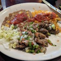 Carnitas · Generous portions of seasoned and fried chunks of pork topped with fresh pico de gallo, guac...