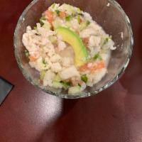 Ceviche · Raw fish cured in citrus juice with onion, cucumber, cilantro and jalapeno; topped with avoc...