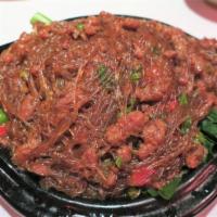 Ants Climb on Tree · Fine minced of filet of beef stir-fried with cellophane noodles in spicy garlic sauce and ga...
