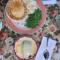 Chicken and Vegetable Pot Pie · Chicken and vegetables in a cream sauce with a delicious pastry crust, served with mashed po...